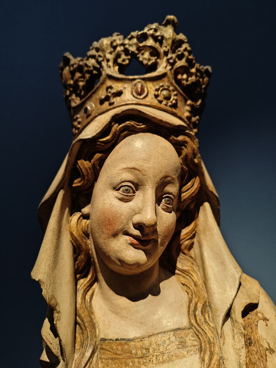 A distorted sculpture of a woman face.