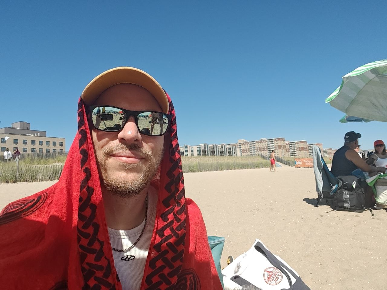 selfie on the beach wrapped in a red towel
